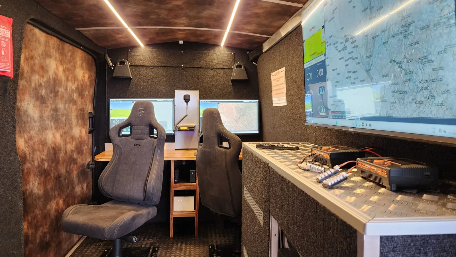 Workstations inside an Aerial Works command and control installation.